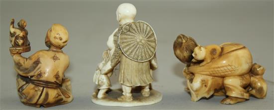 A Japanese ivory netsuke and two similar okimono